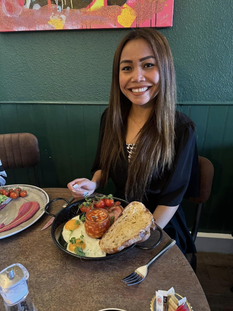 Woman in front of a plate of food