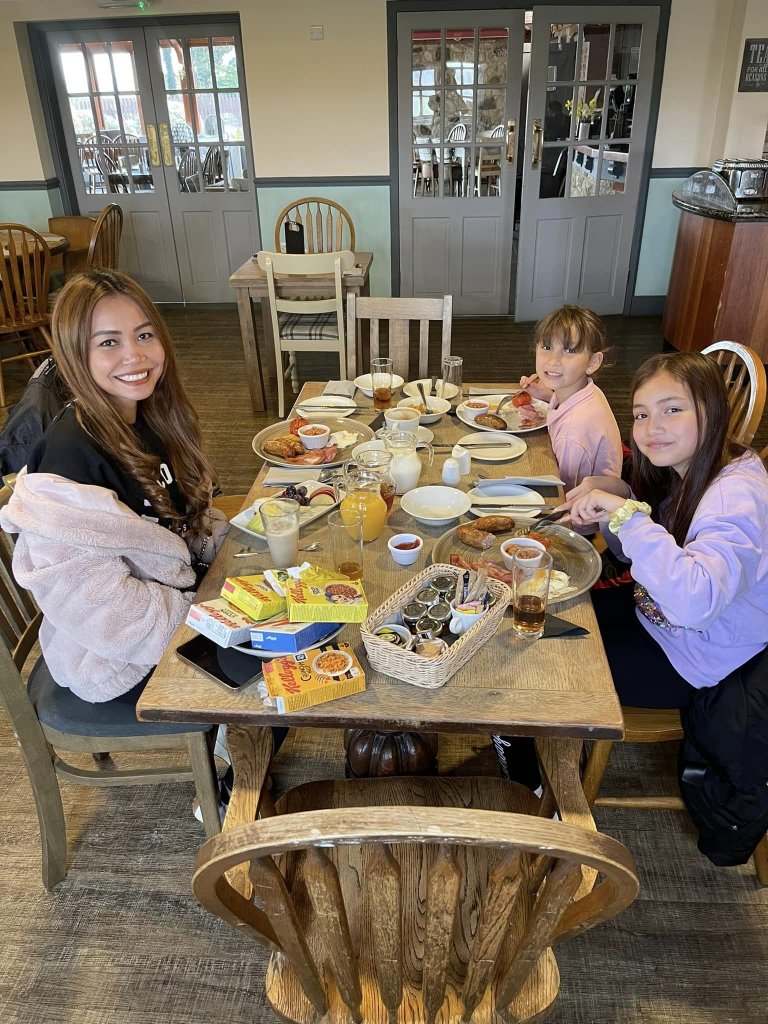 mum and two daughters having a large breakfast at chequers inn