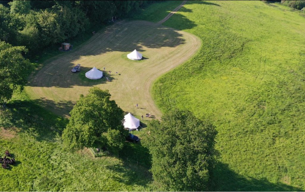 aerial view of three bell tents