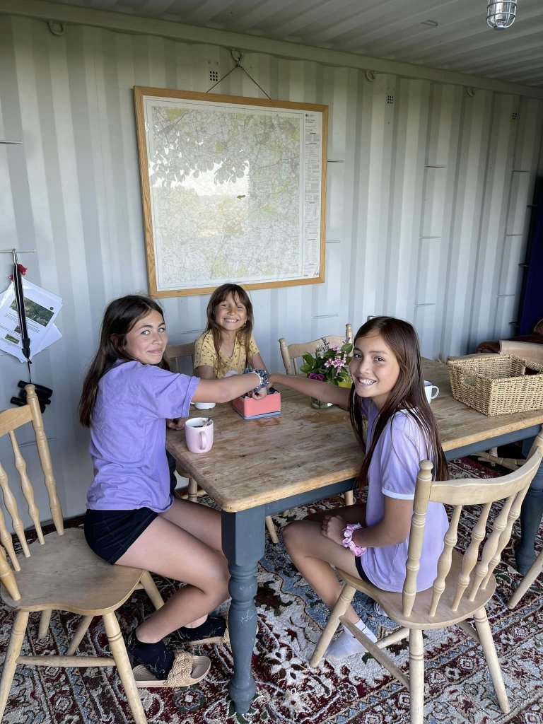 three girls sat at a table