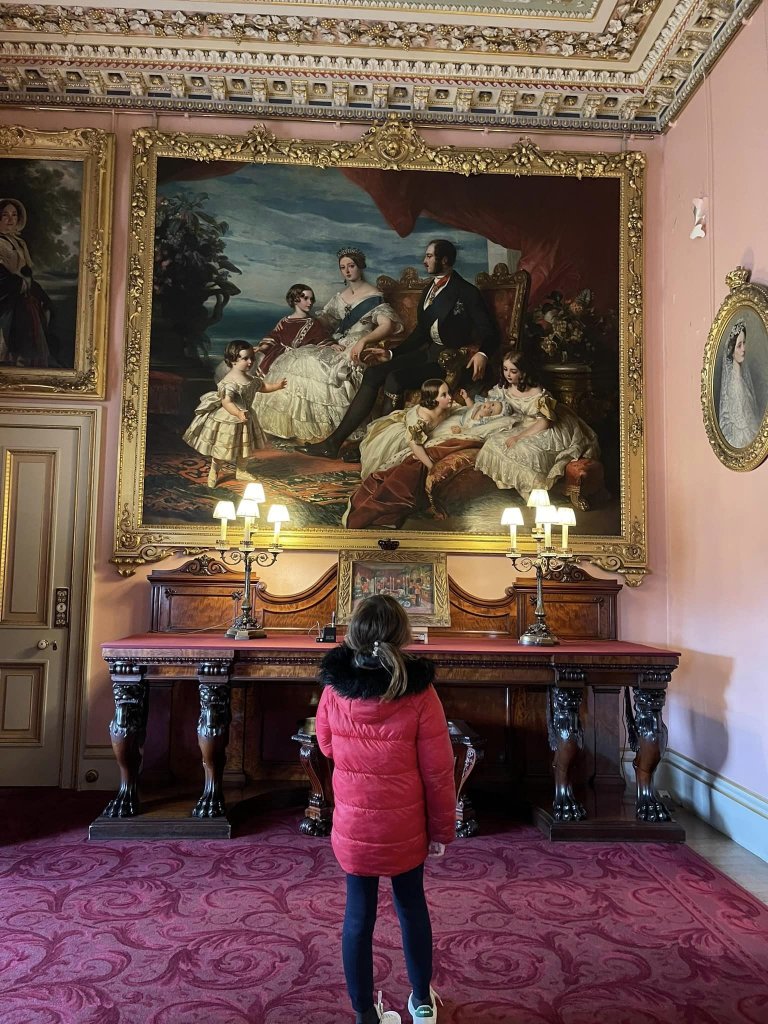 girl looking at large painting in Osbourne House