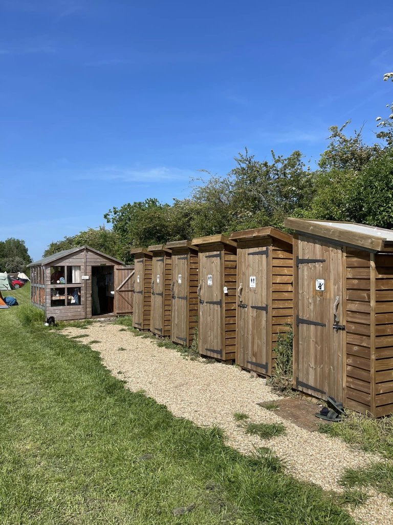 a row of individual shower cabins