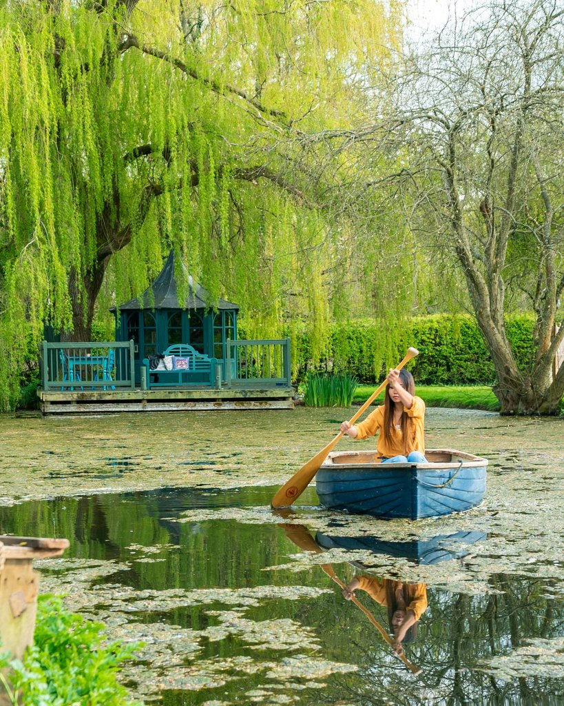 a woman paddling on a row boad